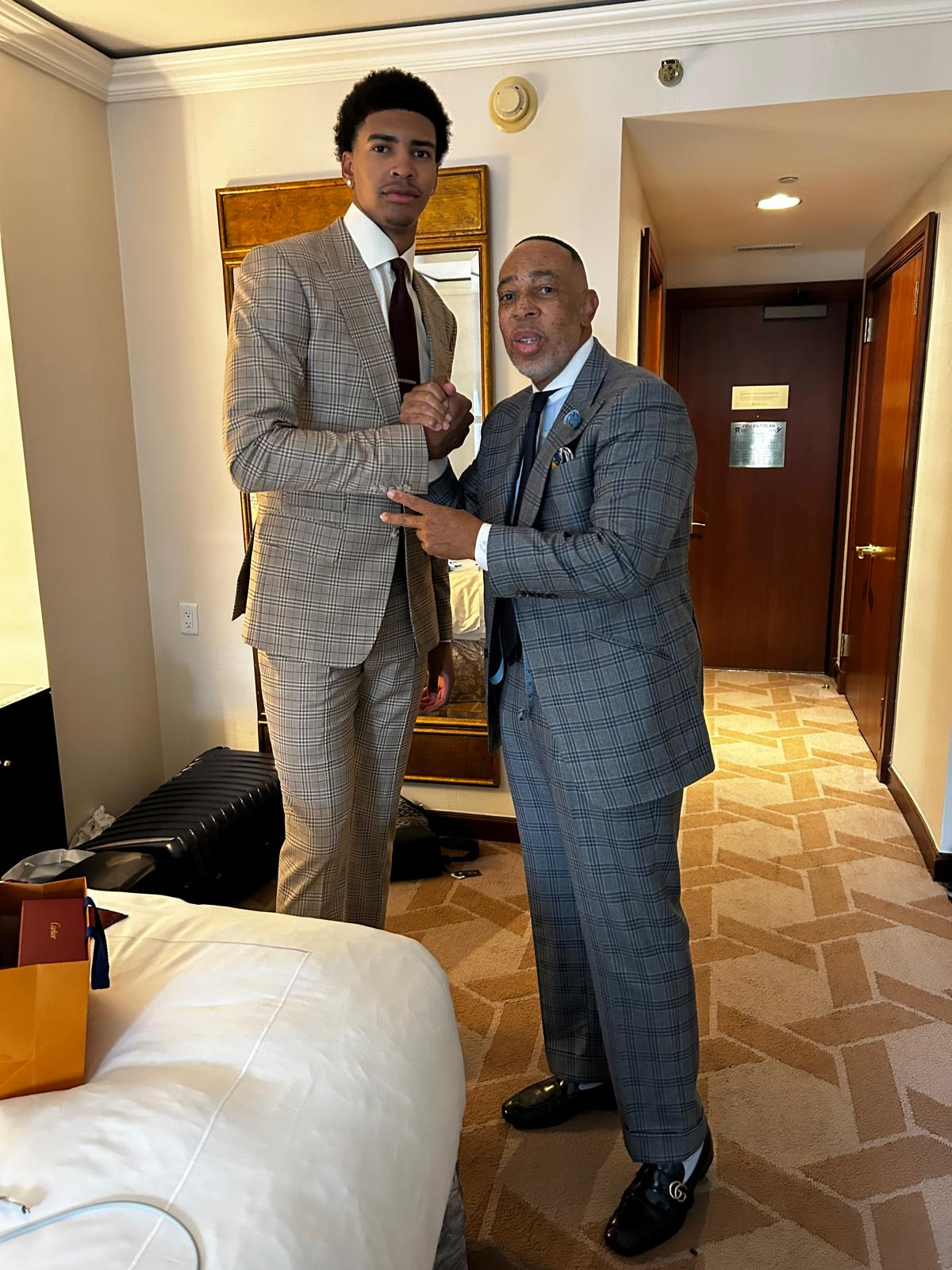 CJ Jones with Chris Cenac Jr. in custom tan plaid suit for 2026 NBA Draft